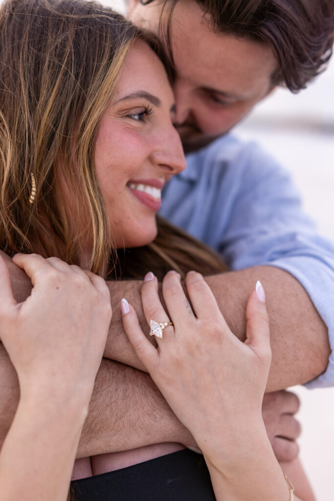happy photo of newly engaged couple showing the ring.